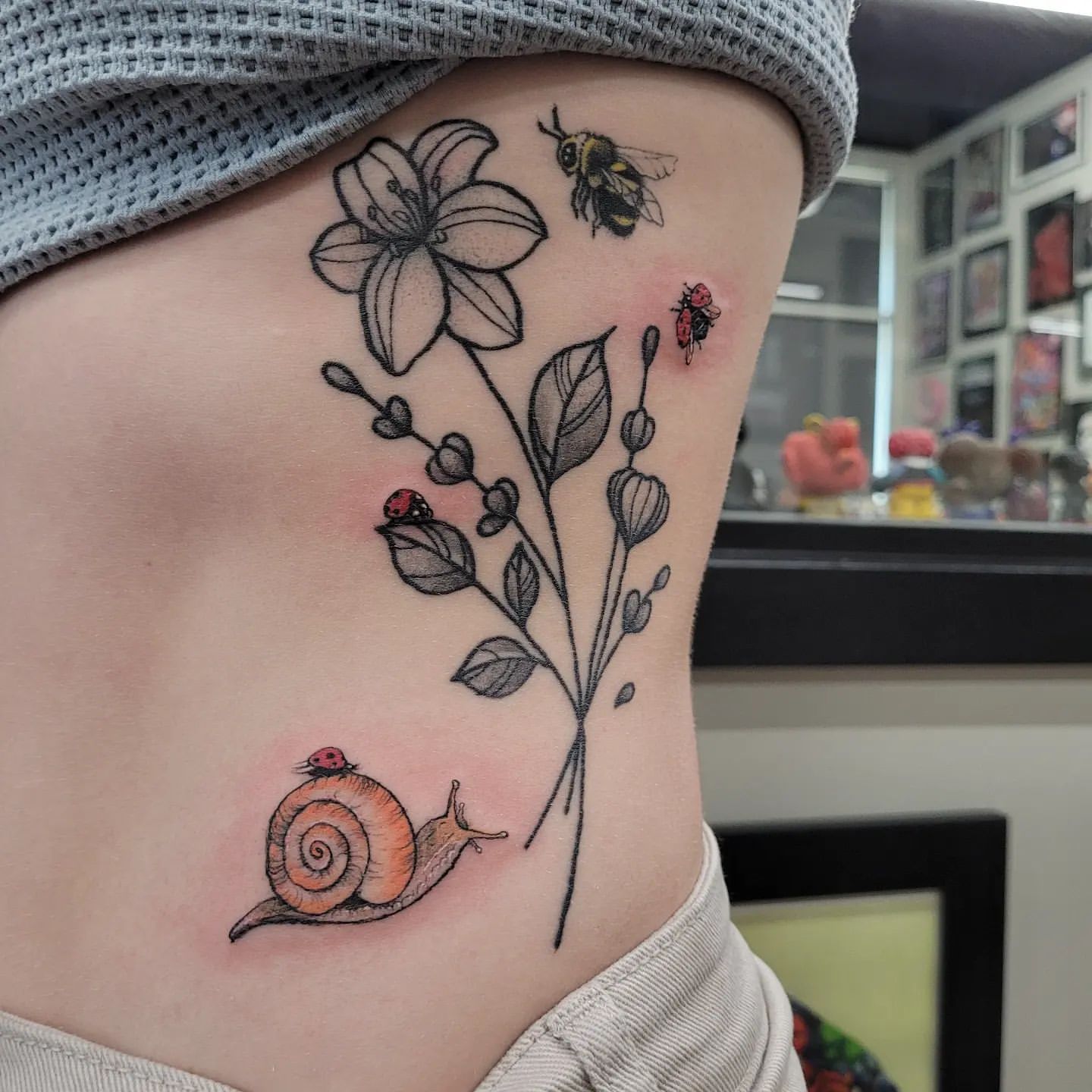 Snail and Bee Tattoo by Ian Wang at Black Gold Tattoo Co in Edmonton Alberta Canada