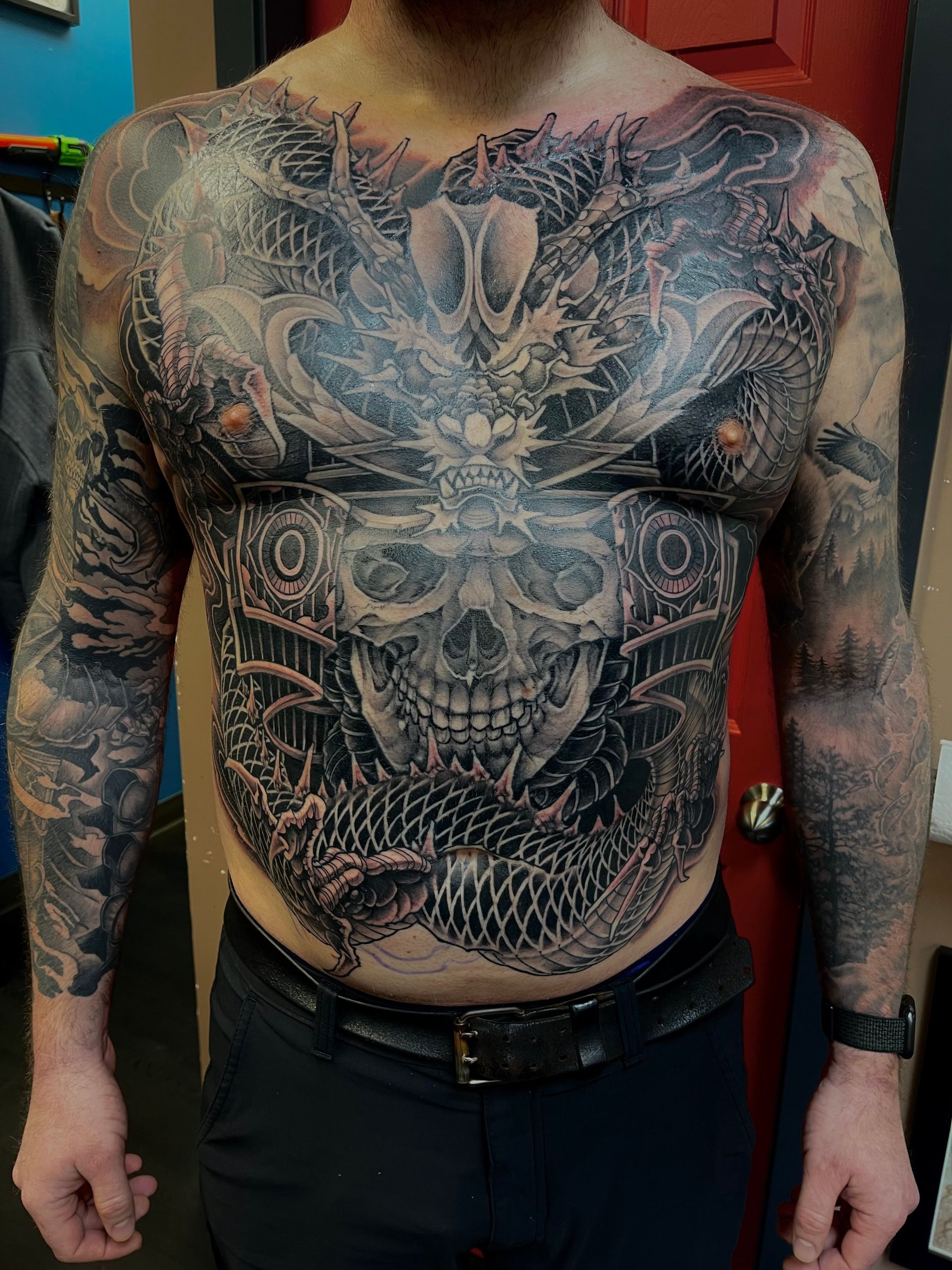 Dragon and Skull Full Torso Tattoo by Brain Dangerfield at Black Gold Tattoo Co in Edmonton Alberta Canada
