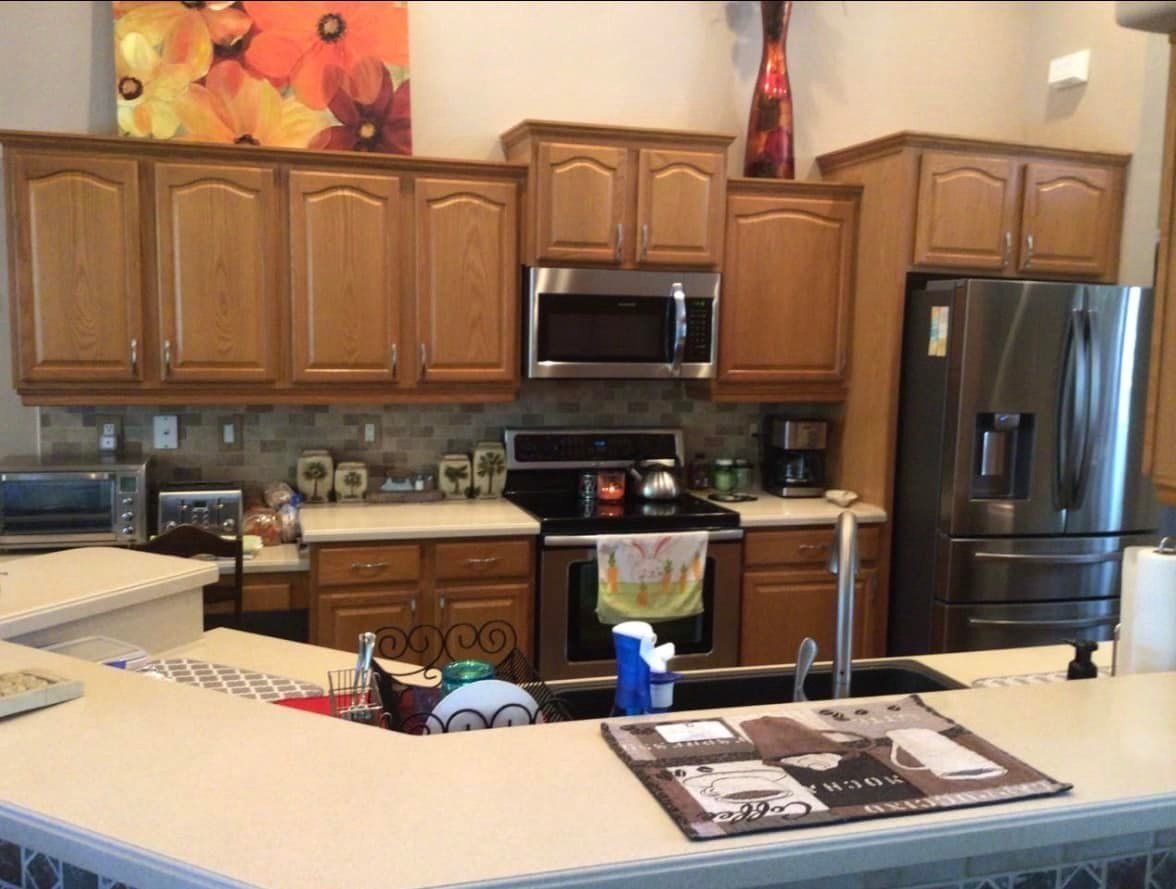 Brown kitchen before remodel by Southern Charm Builders