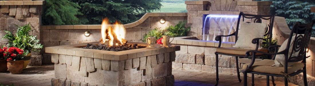 There is a fire pit in the middle of the patio.