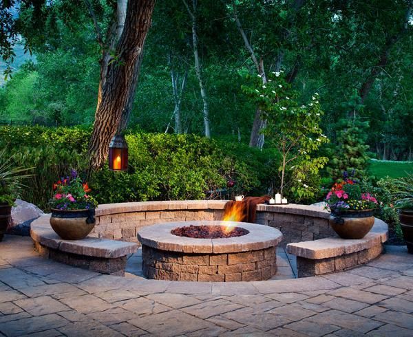 There is a fire pit in the middle of the patio.