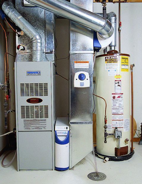 There is a water heater and an air conditioner in the basement.