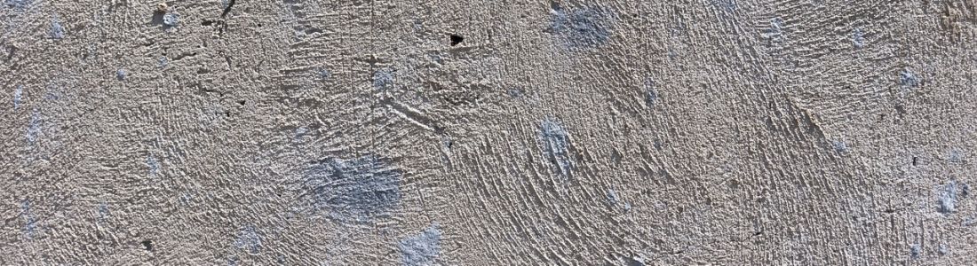 A close up of a gray carpet texture.