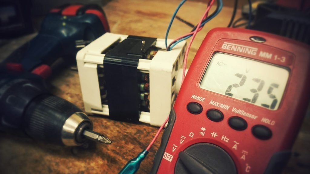 A red multimeter with the number 235 on the screen