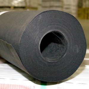 A roll of black paper with a hole in the middle is sitting on a table.
