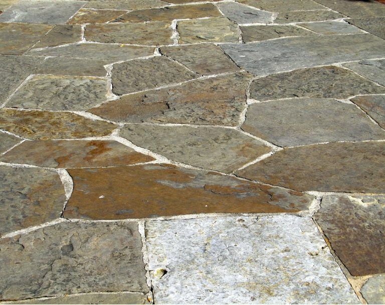 A close up of a stone floor with a lot of stones