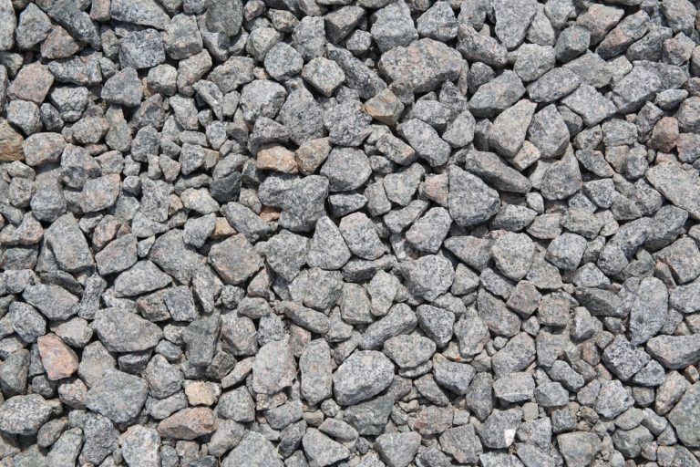 A pile of gravel is sitting on the ground.