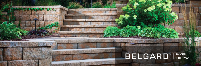 A brick wall with stairs leading up to it