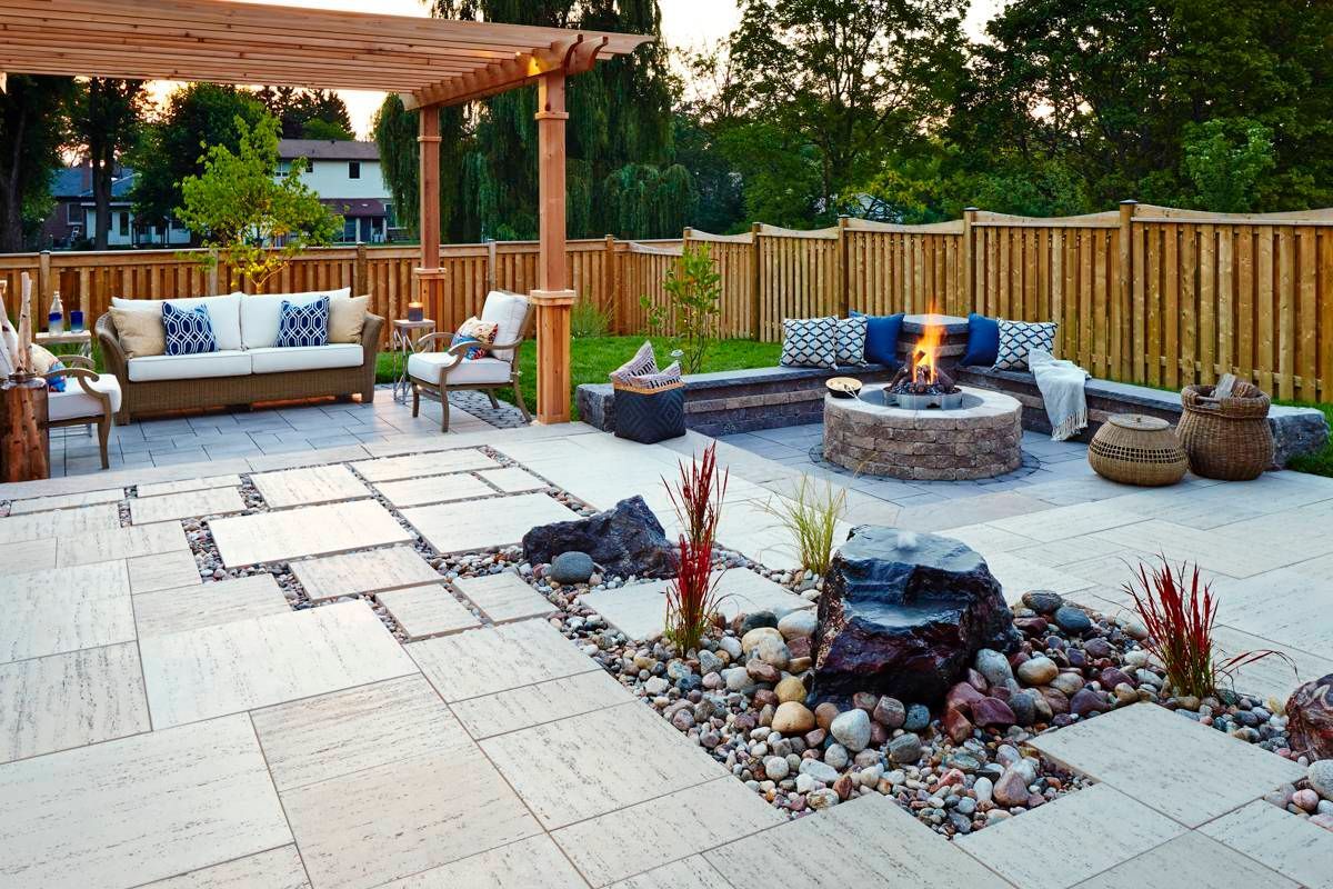 There is a fire pit in the middle of the patio.
