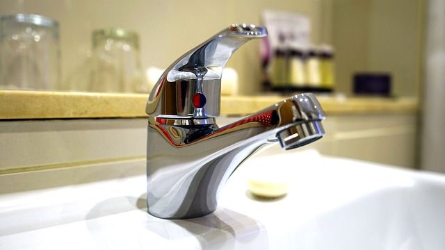 A close up of a faucet on a bathroom sink.