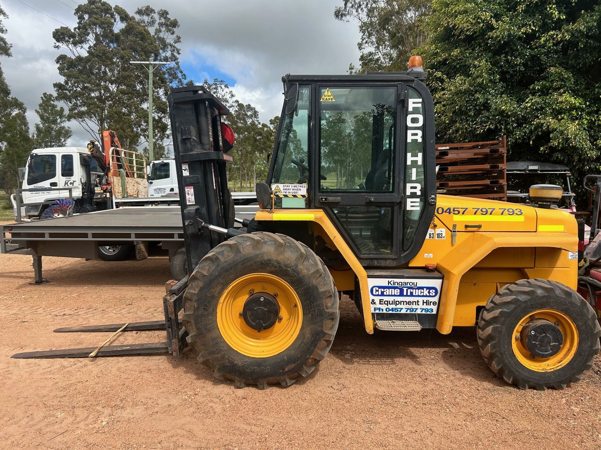 A Blue Truck With A Crane On The Back Is Parked — Kingaroy Crane Trucks & Equipment Hire In Nanango, QLD