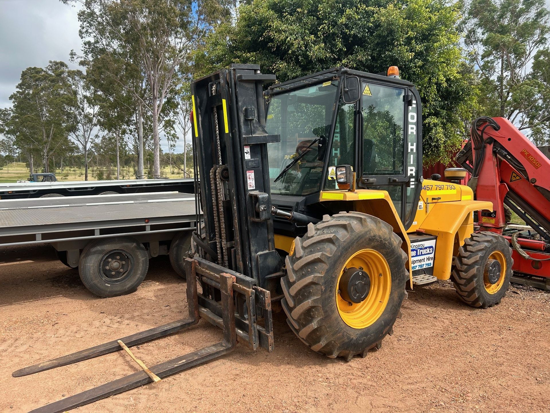 A Toyota Skid Steer Is Parked In A Field — Kingaroy Crane Trucks & Equipment Hire In Mundubbera, QLD