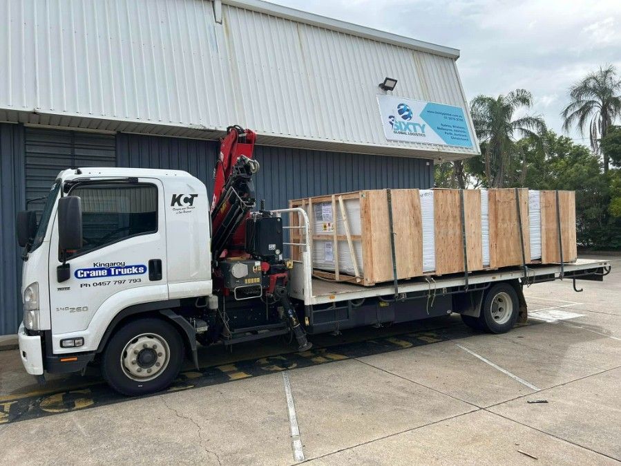 A White Truck With A Crane On The Back Is Parked — Kingaroy Crane Trucks & Equipment Hire In Kingaroy, QLD