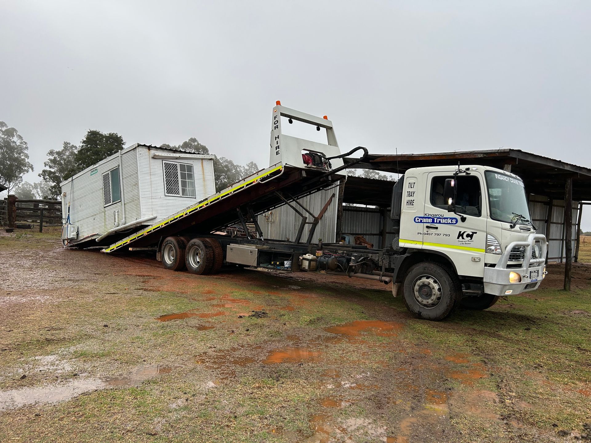 A Truck With A Crane Attached To It Is Parked In Front — Kingaroy Crane Trucks & Equipment Hire In Kingaroy, QLD