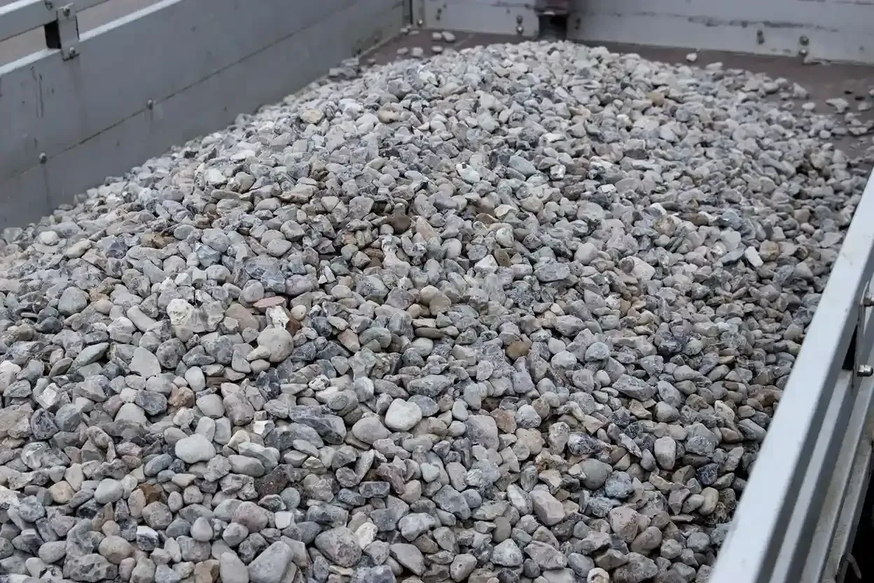 Truck bed filled with gray gravel and stones