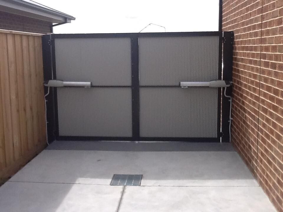 A Brick Wall With A Gate In The Middle Of It – East Gippsland, VIC - East Gippsland Garage Doors & Maintenance