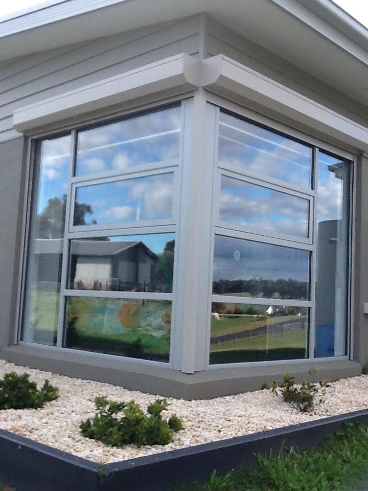 A Large Window On The Side Of A House With A Lot Of Windows – East Gippsland, VIC - East Gippsland Garage Doors & Maintenance