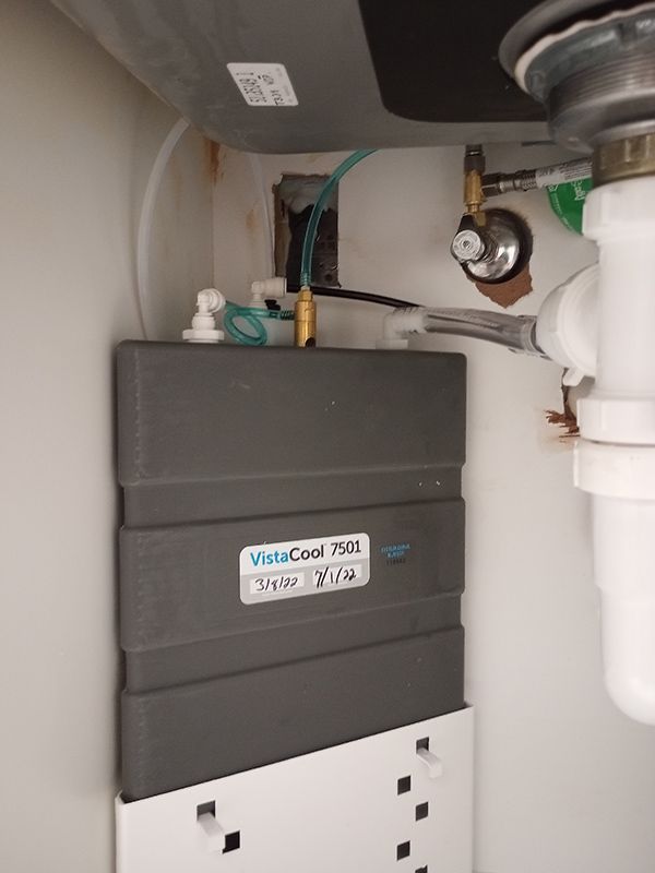 A box under a sink that says visacool on it