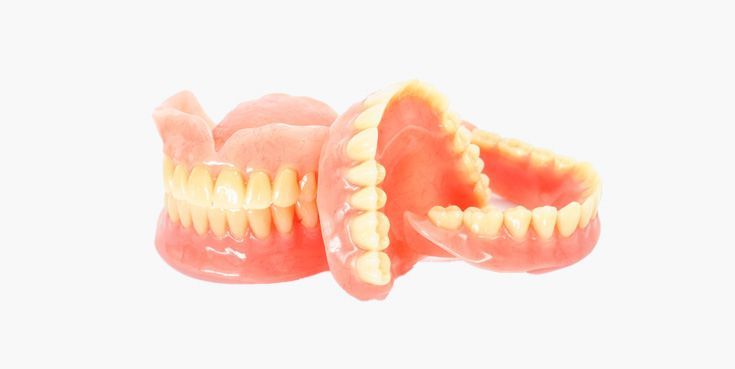 Two sets of dentures, with pink gums and yellow teeth, against a white background.