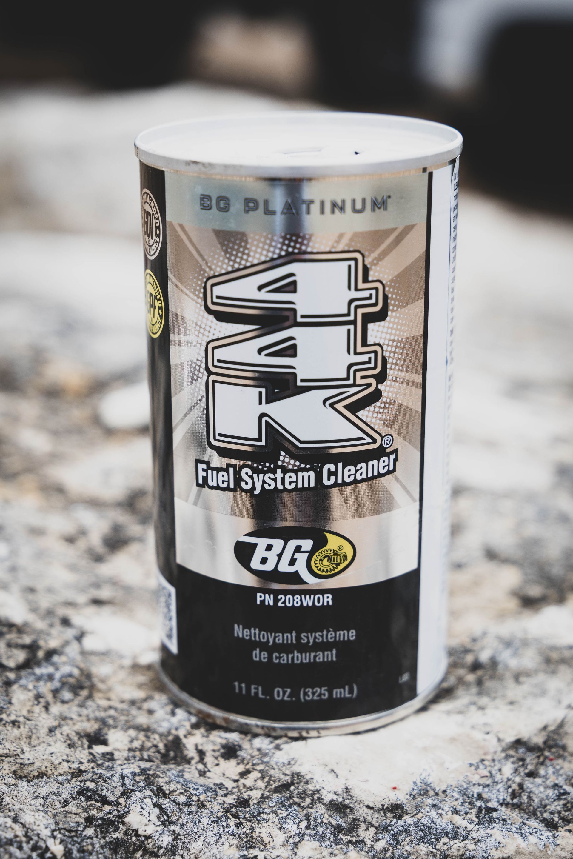 Can of BG Platinum 44K Fuel System Cleaner on a textured surface. Silver and black. | Mountain Top Service Center