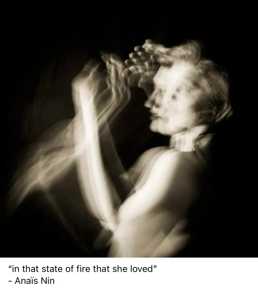 Blurred, sepia-toned image of a woman, arms raised, side profile. Quote by Anais Nin: “in that state of fire that she loved