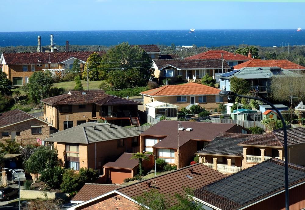 An Aerial View Of A Residential Area With The Ocean In The Background — Chris Stolk Constructions In Corrimal, NSW