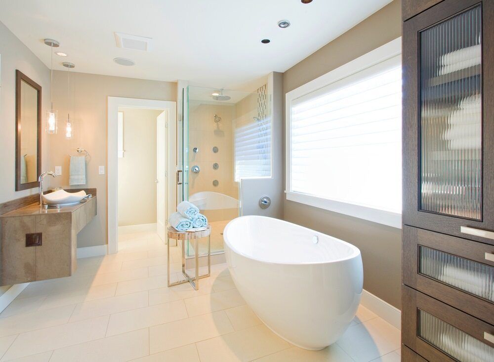 Modern Bathroom with Three Towels and a Bath Tub — Chris Stolk Constructions In Kanahooka, NSW