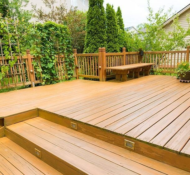 A Wooden Deck With Stairs And A Bench — Chris Stolk Constructions In Kanahooka, NSW