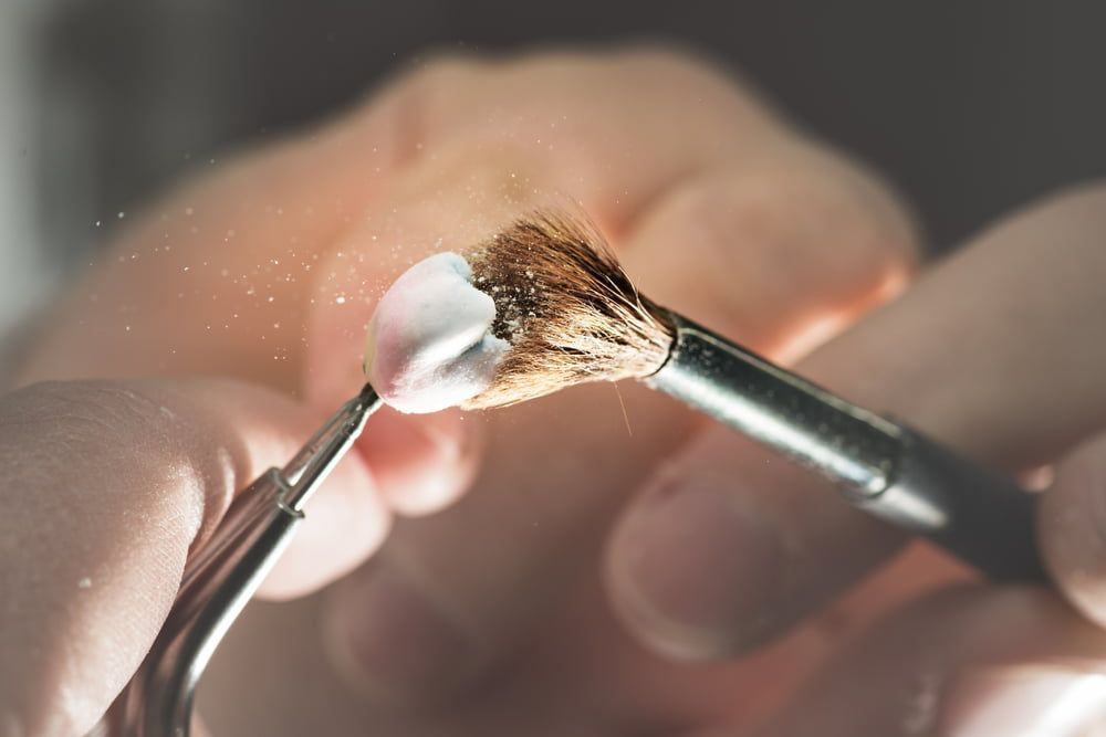 A Close-up Of Brushing a Tooth — Bromley's Denture Clinic in Tweed Heads South, NSW