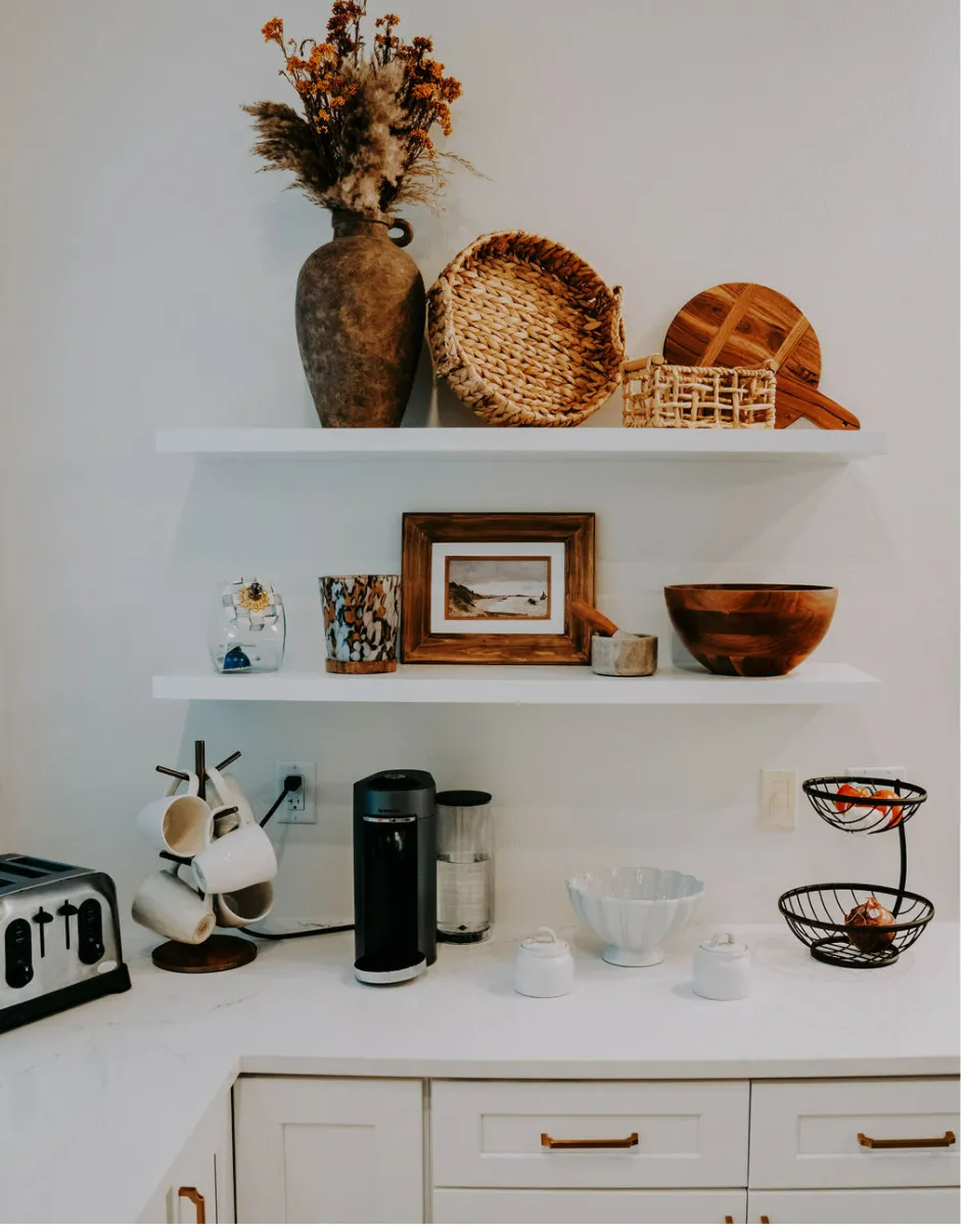 A kitchen with a toaster and a basket on the counter