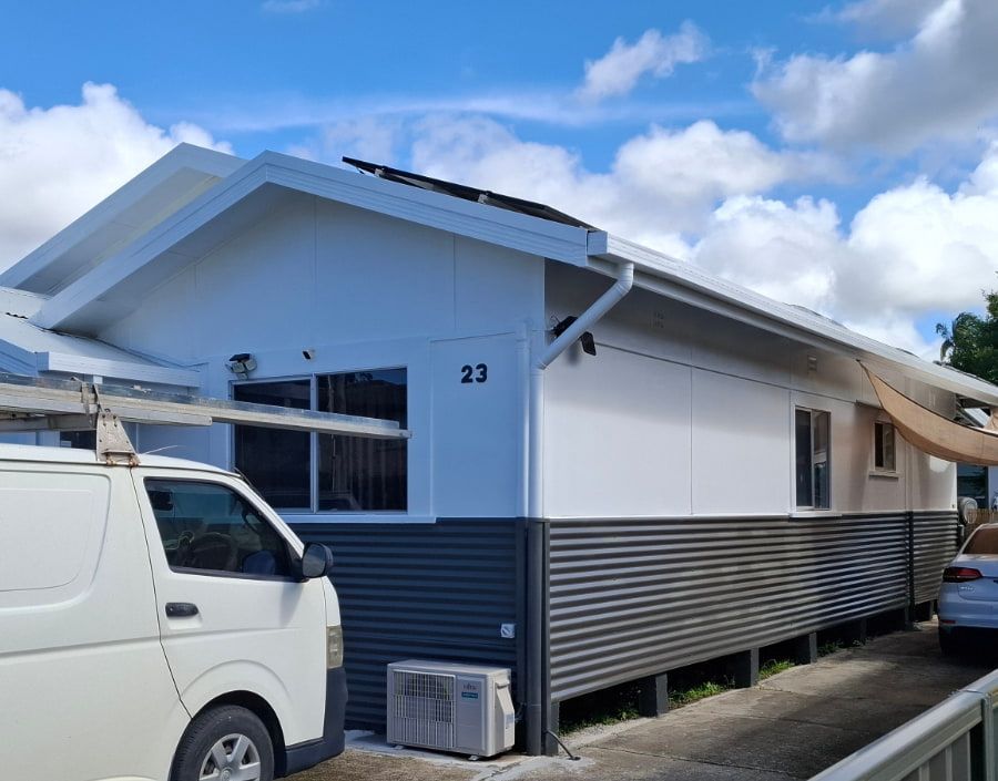 A white van in front of a freshly painted house — Axis Painting in Coffs Harbour, NSW