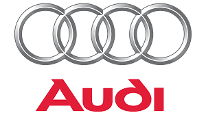 Audi logo: Silver interlocking rings above red brand name.