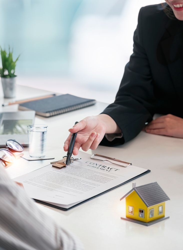 Person Pointing to a Contract Document — Umbrella Legal in Cessnock, NSW