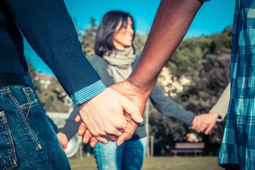 People in a Circle Holding Hands — Umbrella Legal in Cardiff, NSW