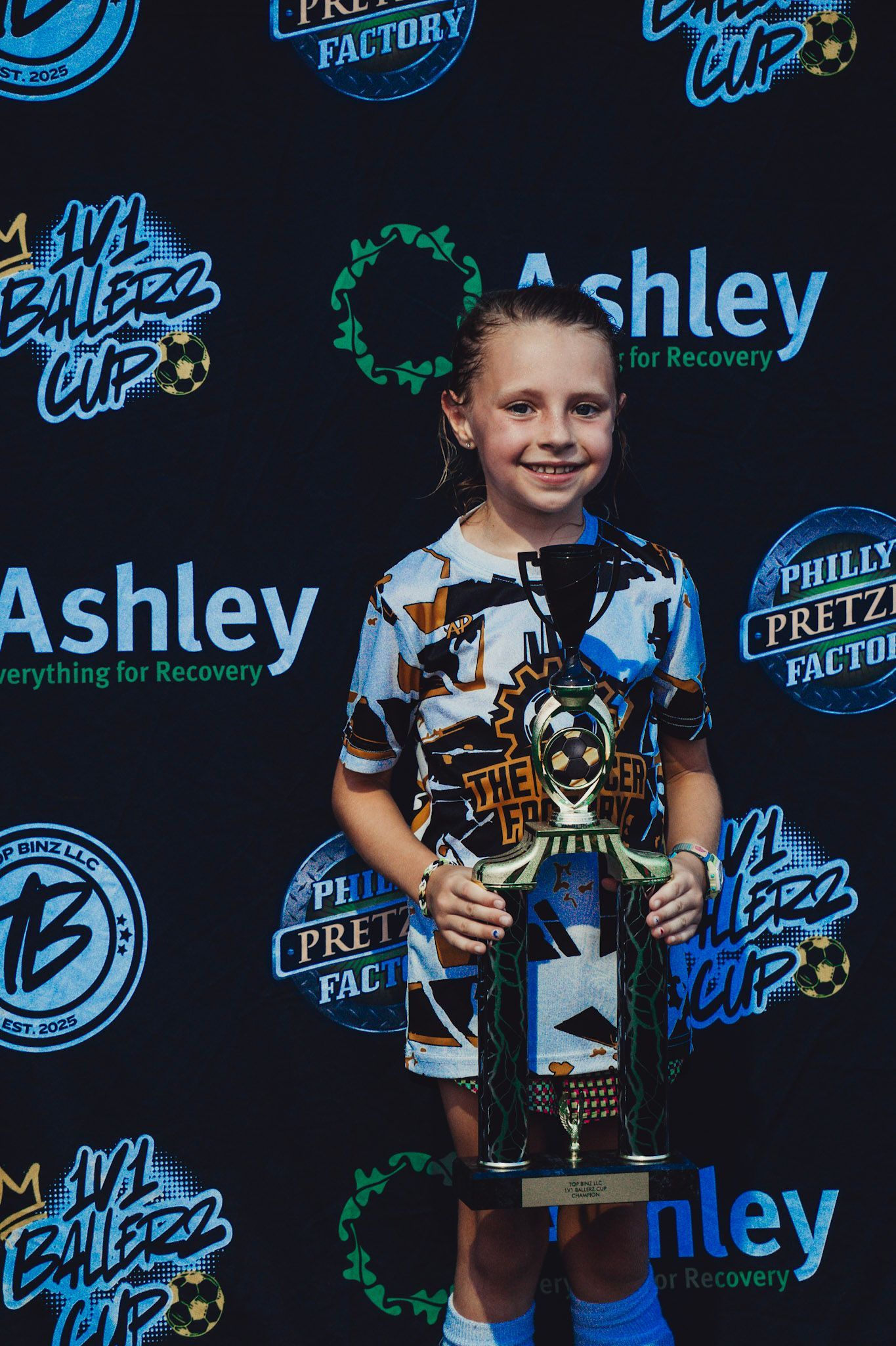 Top Binz Winner Hailey Chesney holding trophy