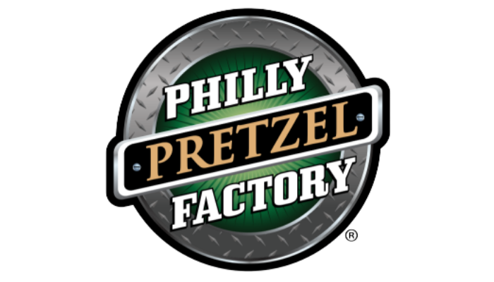 Philly Pretzel Factory logo, black text on a white and green background, surrounded by a silver-gray circle.