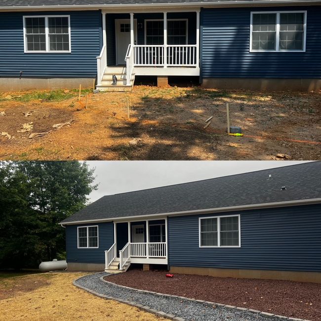 Under-deck crawlspace with concrete posts, gravel, and stacked stone retaining wall.