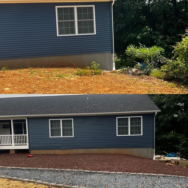House exterior before-and-after: blue siding, new dark roof, gravel landscaping, and porch.