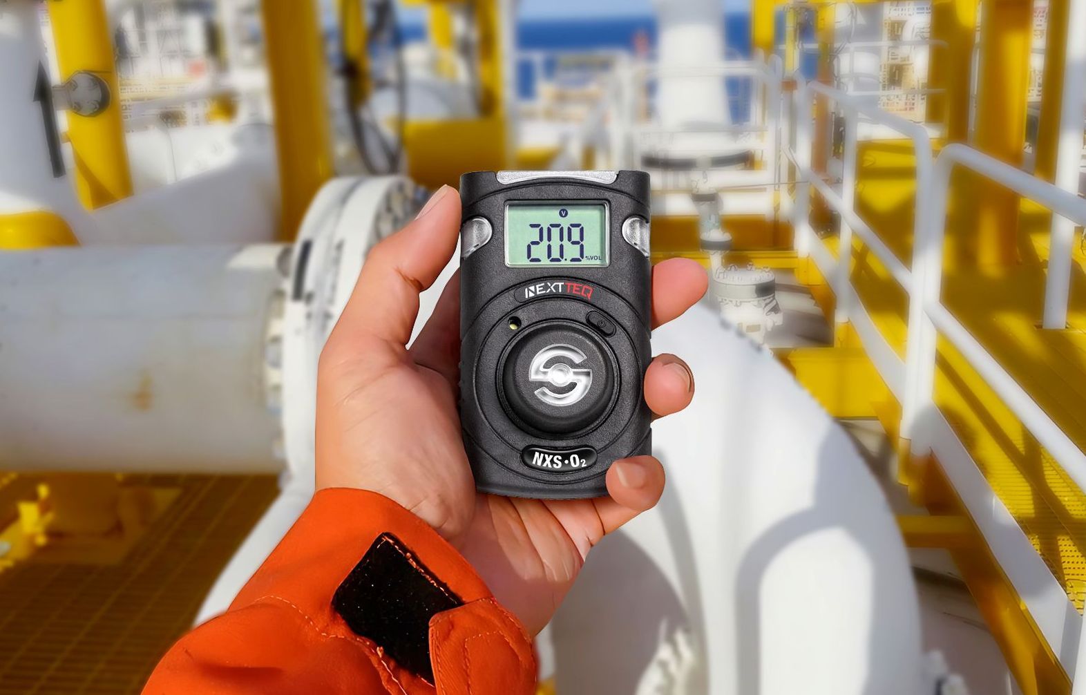 A man's hand holding a Nextteq® NXS Series Single Gas Detector.