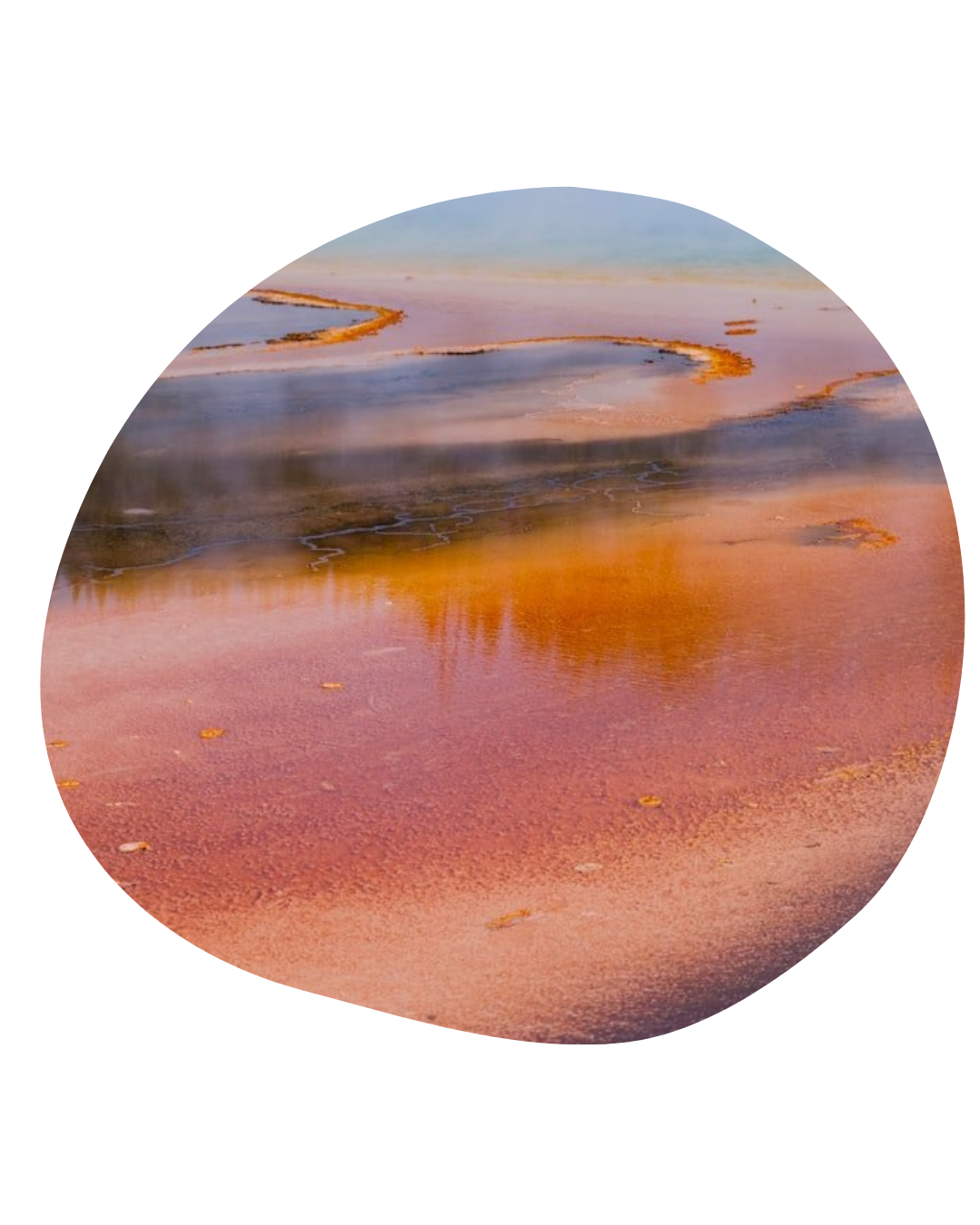 Circular view of a pink-orange salt lake with blue water and distant shoreline