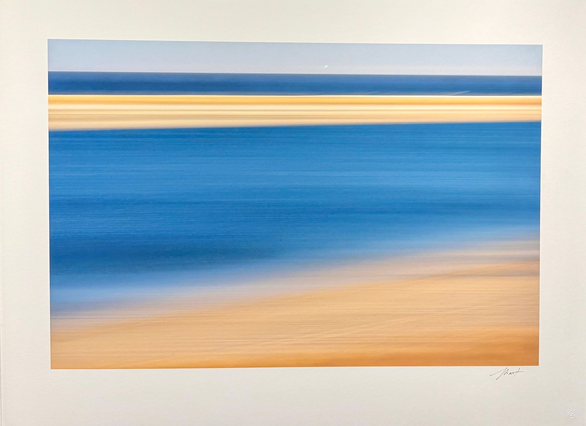 Abstract seascape with blue water and sandy shoreline in soft horizontal bands