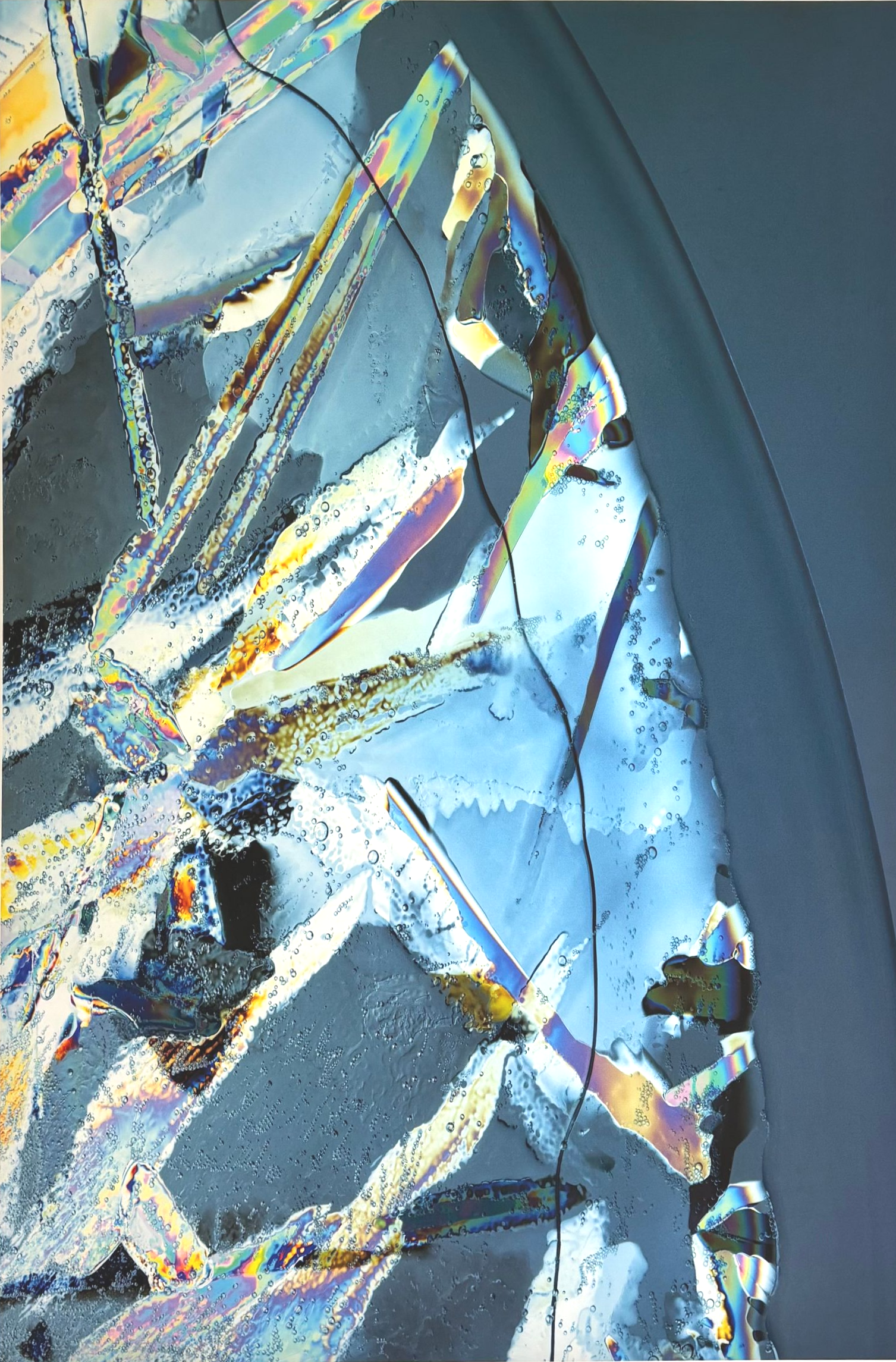 Abstract colorful fractured glass pattern with blue, yellow, and white reflections