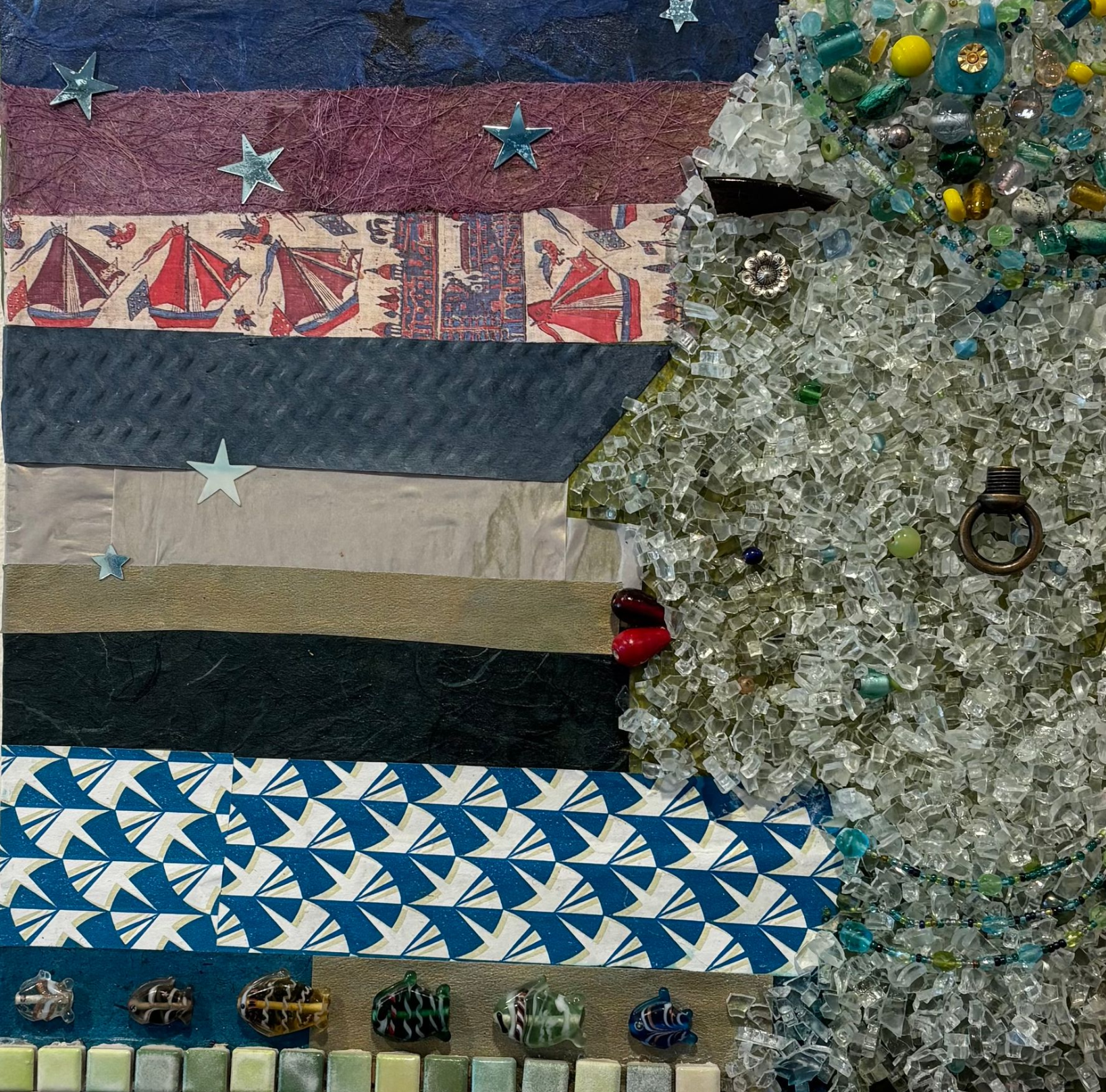 Mosaic artwork of a sailboat and tree with layered colorful stripes and star accents