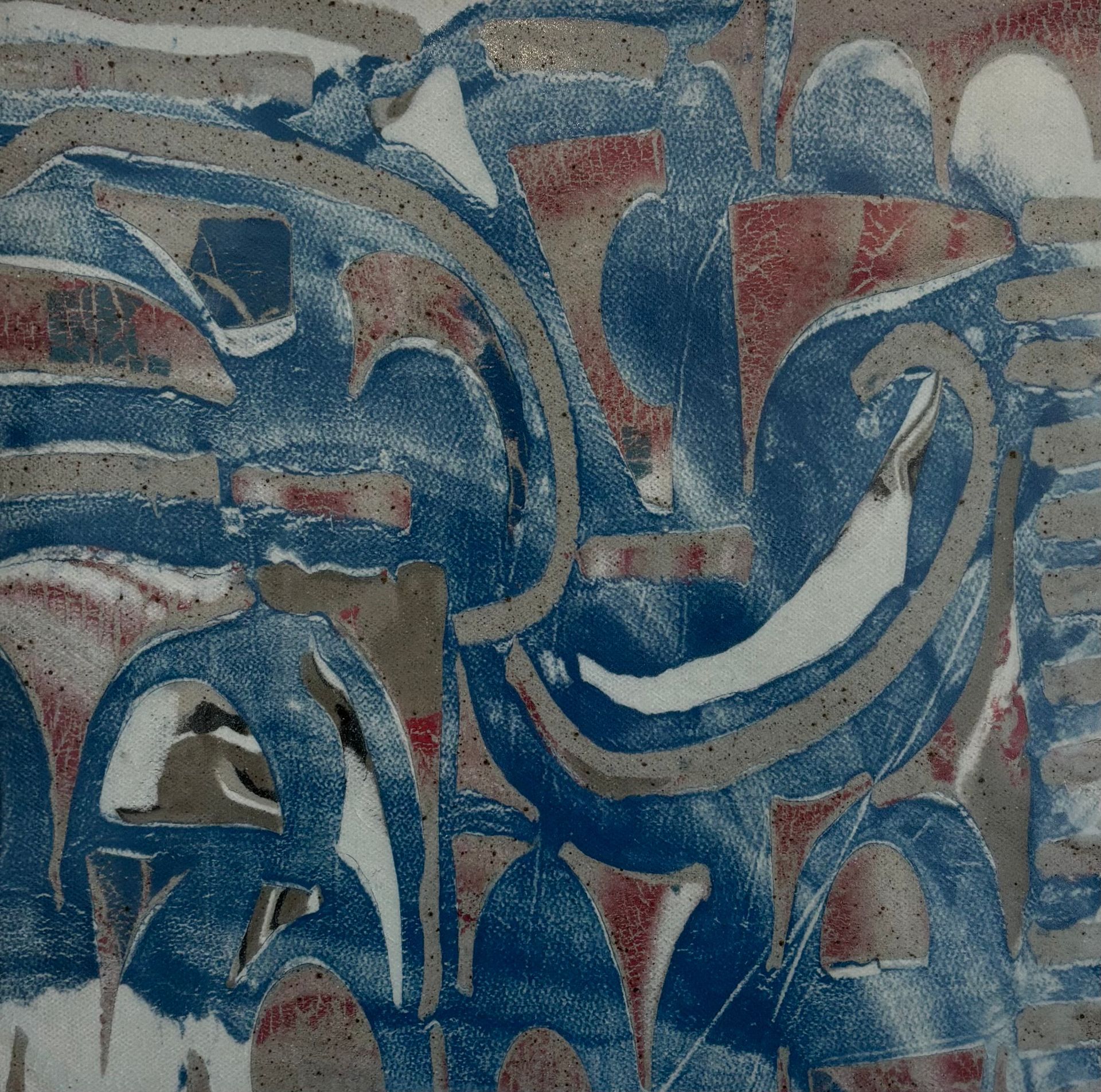 Abstract blue, red, and white geometric mural with curved shapes on a textured wall