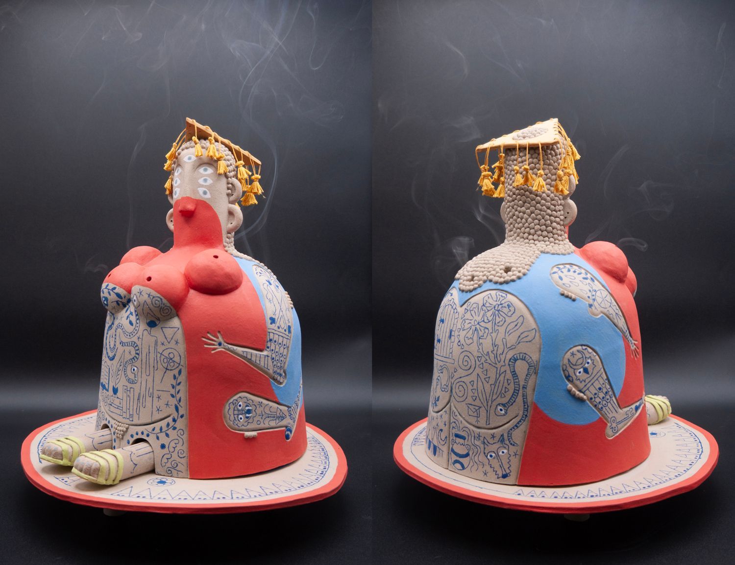 Decorated cake with red and blue icing, gold accents, and a smoky top, shown from two angles