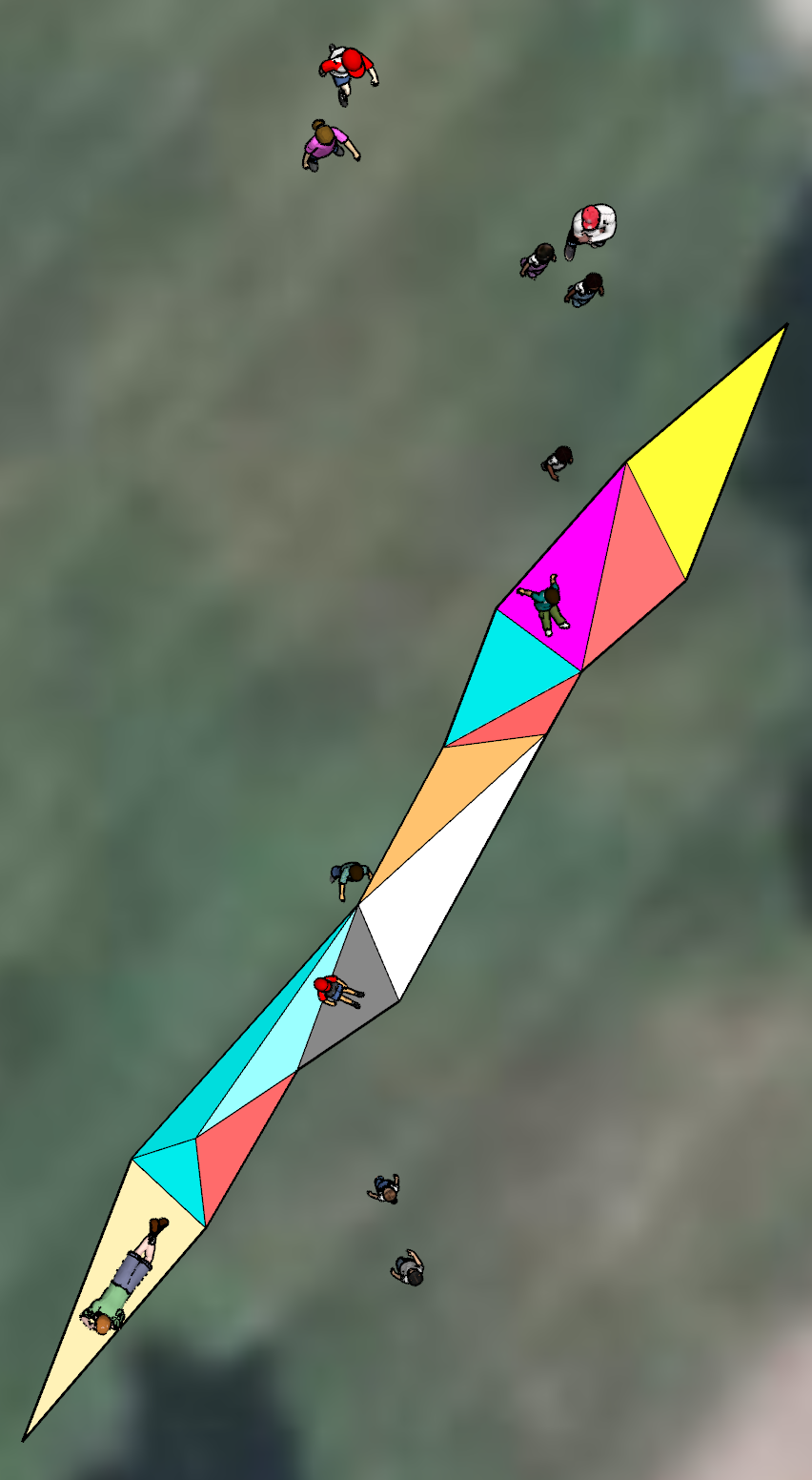 Colorful triangular kite flying diagonally across a blurred background with tiny people below