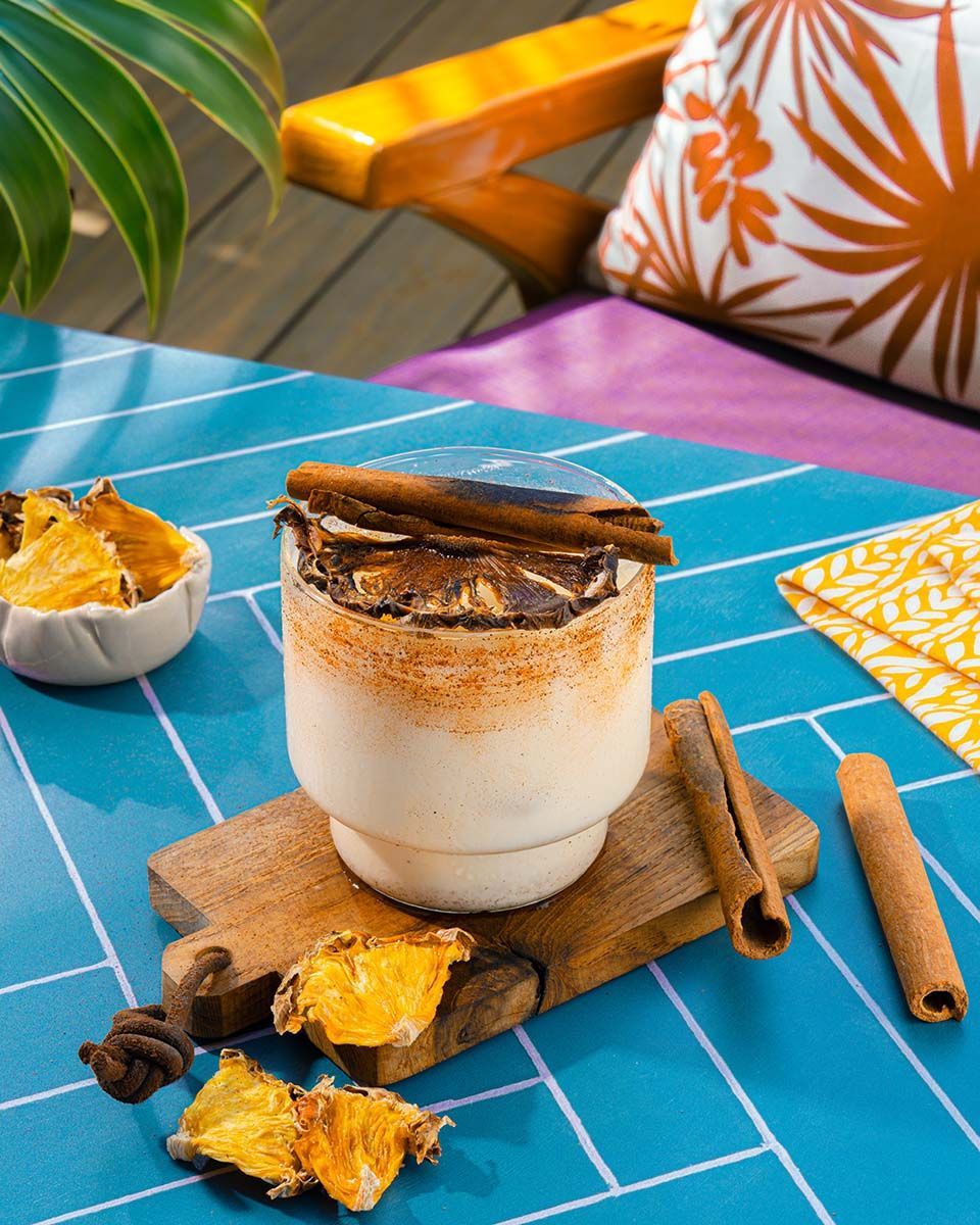 Signature cinnamon beverage served on wooden board at Flamingo Social in Hue hotel Boracay