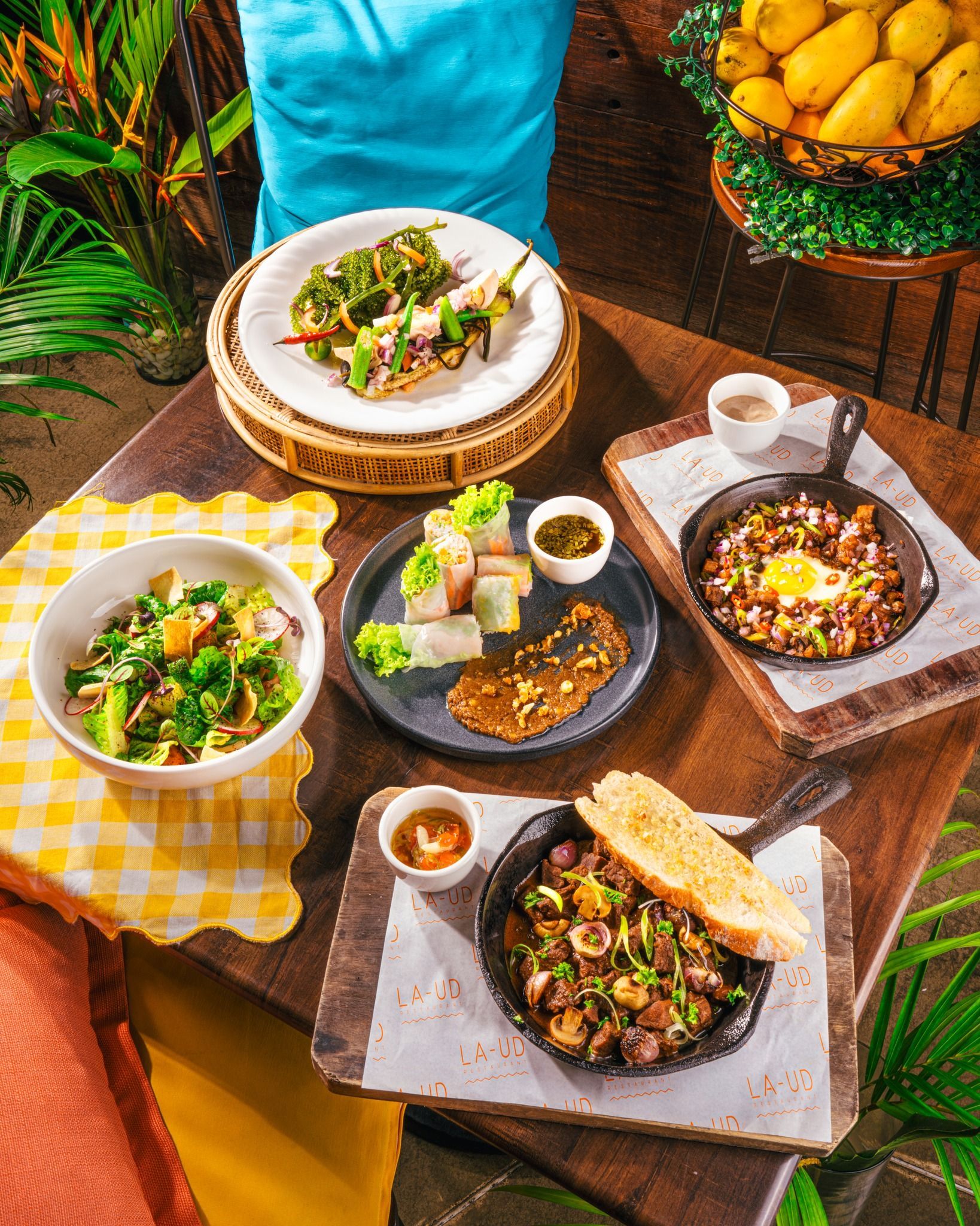 A table topped with plates of food and bowls of food in top restaurants in Puerto Princesa