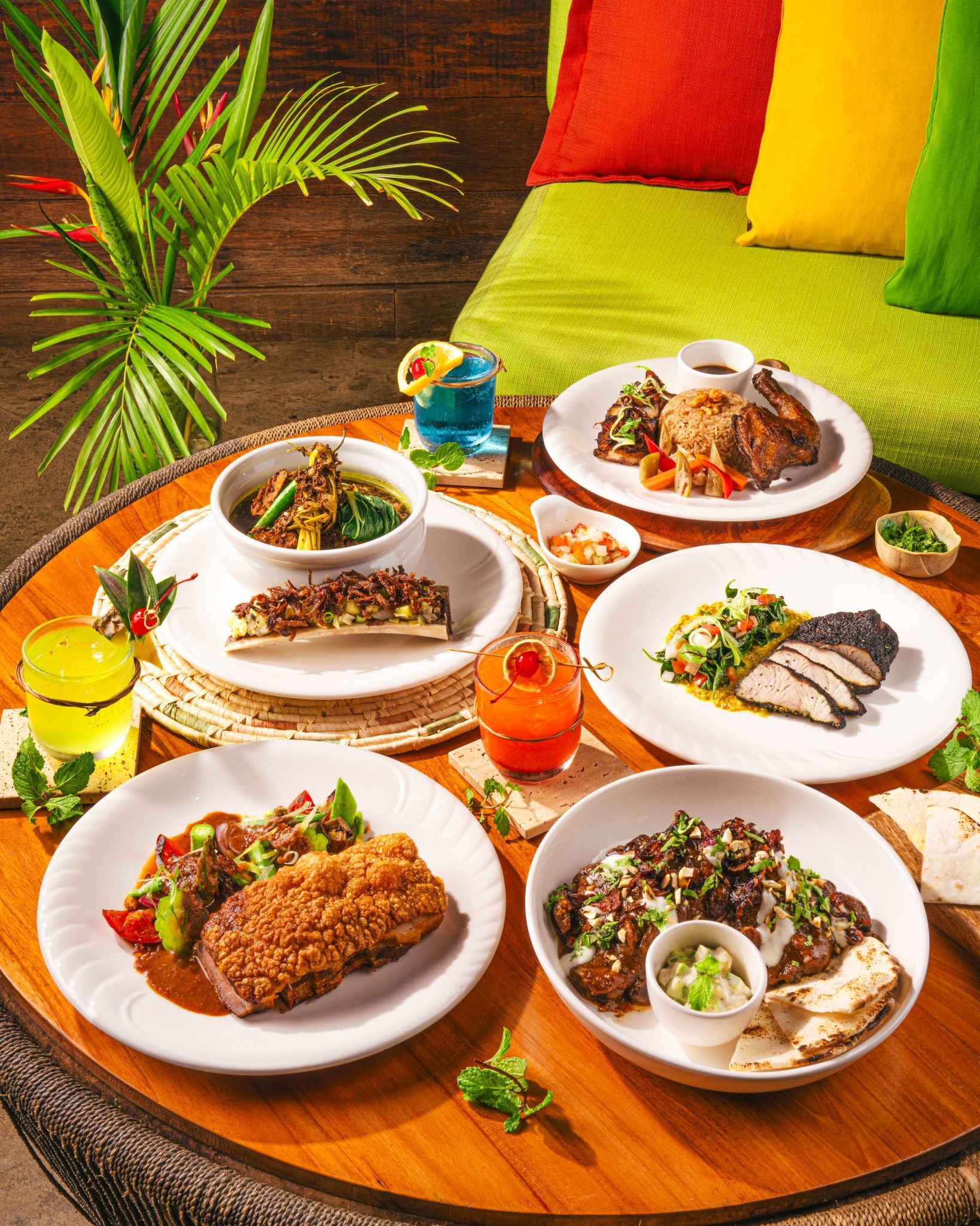 A table topped with plates of food and drinks in Puerto Princesa restaurants
