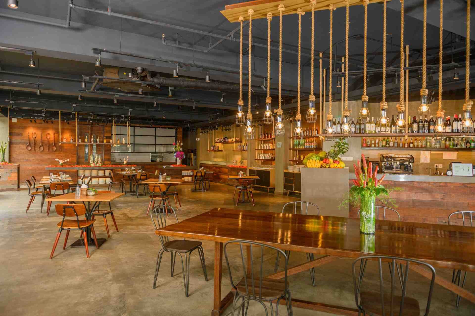 Modern industrial dining space at Hue - Puerto Princesa restaurant with minimalist decor.